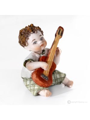 EDDIE - Piezas únicas: músico con guitarra, muñecos de porcelana italiana.